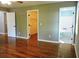 Main bedroom with hardwood floors and ensuite bathroom access at 617 Casey Ln, Mebane, NC 27302
