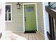 Charming green front door with glass accents and black hardware at 617 Casey Ln, Mebane, NC 27302