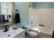 Updated bathroom with a tub and shower, white vanity, and stylish fixtures at 617 Casey Ln, Mebane, NC 27302