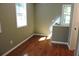 Well-lit bedroom with hardwood floors and window at 617 Casey Ln, Mebane, NC 27302