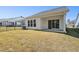 Spacious backyard with grassy area and covered patio at 2269 Abbeyhill Dr # 133, Raleigh, NC 27610