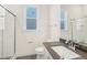 Bathroom with single vanity, dark countertop, and shower at 2269 Abbeyhill Dr # 133, Raleigh, NC 27610