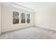 Spacious bedroom with neutral carpeting and large windows at 2269 Abbeyhill Dr # 133, Raleigh, NC 27610