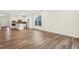 Open dining area with hardwood floors and kitchen view at 2269 Abbeyhill Dr # 133, Raleigh, NC 27610