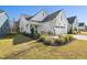 Craftsman style home with white siding, two-car garage, and landscaped front yard at 2269 Abbeyhill Dr # 133, Raleigh, NC 27610