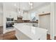 Modern kitchen with white cabinets, quartz countertops, and stainless steel appliances at 2269 Abbeyhill Dr # 133, Raleigh, NC 27610