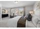 Main bedroom with a king-size bed, neutral decor, and views of the neighborhood at Tbd Channel Drop Dr # 123, Clayton, NC 27520