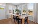 Bright dining area with a large wooden table and plenty of natural light at Tbd Channel Drop Dr # 123, Clayton, NC 27520