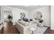 Cozy living room with hardwood floors, neutral decor, and comfortable seating at Tbd Channel Drop Dr # 94, Clayton, NC 27520