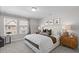 Spacious main bedroom with plush carpeting, large windows, and plenty of natural light at Tbd Channel Drop Dr # 94, Clayton, NC 27520