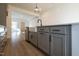Gray kitchen island with farmhouse sink and black faucet at 108 Swain St, Clayton, NC 27527