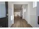 Bright entryway with hardwood floors, leading to kitchen and living areas at 108 Swain St, Clayton, NC 27527