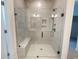 Modern bathroom with large glass shower and built-in seat at 108 Swain St, Clayton, NC 27527