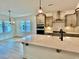 Modern kitchen with island and view into dining and living areas at 108 Swain St, Clayton, NC 27527