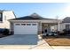 Single-story home with a two-car garage and landscaping at 108 Swain St, Clayton, NC 27527
