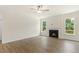 Living room with fireplace and large windows at 95 Quail Point Cir, Clayton, NC 27520