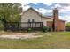 Large backyard with deck and partial view of house at 1054 George Bason Rd, Graham, NC 27253