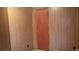 Small bedroom with wood paneled walls and a door at 2319 Nc 86, Hillsborough, NC 27278