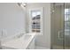 Modern bathroom with quartz countertop and glass shower at 2651 Marchmont St, Raleigh, NC 27608