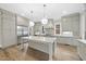 Spacious kitchen with light cabinets, marble island, and hardwood floors at 2651 Marchmont St, Raleigh, NC 27608