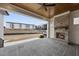 Covered patio with fireplace and sliding glass doors at 2651 Marchmont St, Raleigh, NC 27608