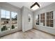 Office space with hardwood floors, wainscoting, and ample natural light at 2651 Marchmont St, Raleigh, NC 27608