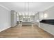 Open concept kitchen with island, stainless steel appliances, and light cabinetry at 2651 Marchmont St, Raleigh, NC 27608