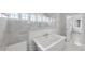 Spa-like bathroom with a large walk-in shower and soaking tub at 2651 Marchmont St, Raleigh, NC 27608
