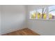 Cozy bedroom with hardwood floors and a large window offering natural light at 2408 Everett Ave, Raleigh, NC 27607