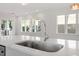 Modern kitchen features stainless steel sink and white quartz countertops at 2408 Everett Ave, Raleigh, NC 27607