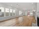 Large living area with hardwood floors and views into kitchen and dining areas at 2408 Everett Ave, Raleigh, NC 27607