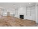 Spacious living room showcasing hardwood floors, built-in shelving, and a fireplace at 2408 Everett Ave, Raleigh, NC 27607