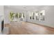 Open living space with hardwood floors, sliding glass doors, and lots of natural light at 2408 Everett Ave, Raleigh, NC 27607