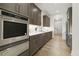 Modern kitchen with stainless steel appliances and gray cabinets at 213 Westhampton Dr, Pittsboro, NC 27312