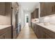 Modern kitchen with gray cabinets, stainless steel appliances, and quartz countertops at 213 Westhampton Dr, Pittsboro, NC 27312