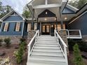 Front entry with white staircase and stone accents at 1350 Geneva Albright Rd, Graham, NC 27253