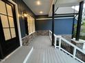 Covered porch with stone accents and a view of the yard at 1350 Geneva Albright Rd, Graham, NC 27253