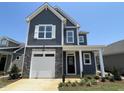 Two-story home with gray siding and stone accents at 112 Swain St, Clayton, NC 27527