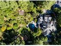 Aerial view of a house and lush gardens, showcasing expansive landscaping at 2441 W Lake Dr, Raleigh, NC 27609