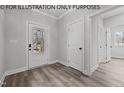Bright entryway with hardwood floors, white door, and access to other rooms at 622 Sherron Rd, Durham, NC 27703