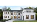 White brick exterior of a two-story home at 4218 Lambeth Dr, Raleigh, NC 27609
