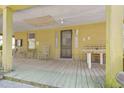 Rustic front porch with wooden flooring and vintage furniture at 283 Old Christian Chapel Rd, New Hill, NC 27562