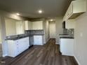 Modern kitchen with granite countertops and stainless steel appliances at 91 Lotus Ave, Smithfield, NC 27577