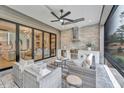 Outdoor kitchen with built-in grill, refrigerator, and seating area at 1312 Hunting Ridge Rd, Raleigh, NC 27615