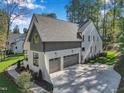 Aerial view of a modern house with a gray and white color scheme at 1312 Hunting Ridge Rd, Raleigh, NC 27615