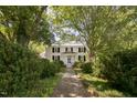Brick pathway to charming white farmhouse at 6720 Mebane Oaks Rd, Mebane, NC 27302