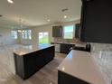 Open concept kitchen with large island at 352 Chestnut Oak Ln, Lillington, NC 27546