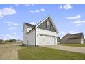 Two-story house with white siding, gray roof, and a two-car garage at 53 Hillwood Dr, Sanford, NC 27332