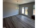Bright dining area with hardwood floors and access to the backyard at 1031 Westerland Way # 46, Durham, NC 27703