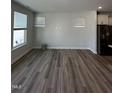 Spacious living room with hardwood floors and large windows at 1031 Westerland Way # 46, Durham, NC 27703